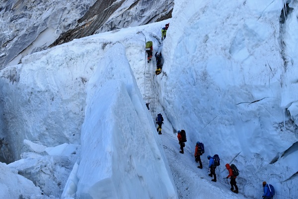 8. Climbers move up the Khumbu Icefall