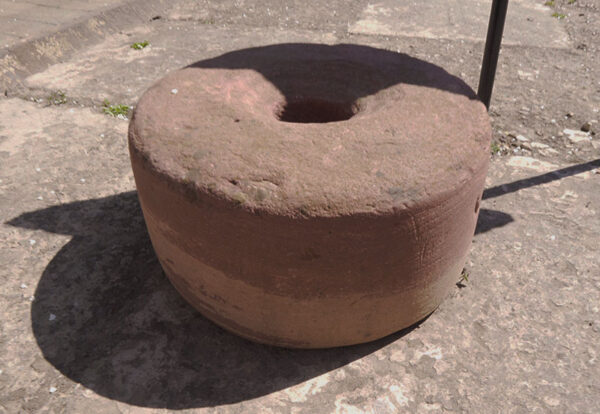 An old clay mortar grinder