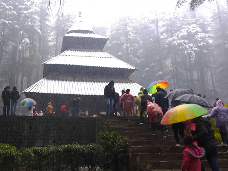 Devotees climbing the stairs of Hadimba temple in Manali