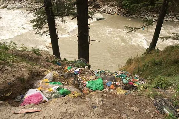 Heaps of garbage thrown into the Parvati river in Kasol. 